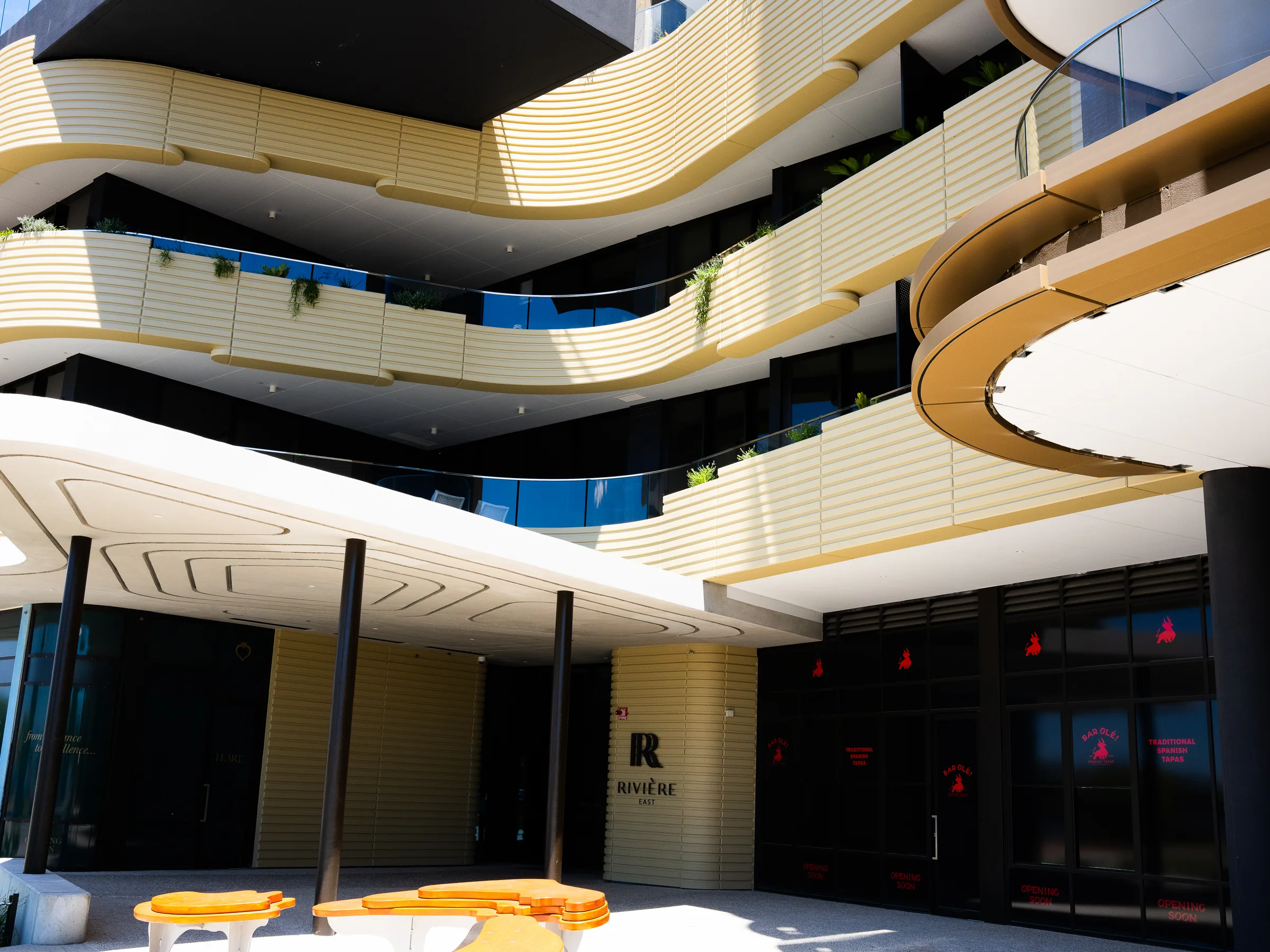 Curved balcony blades stacking up an apartment facade